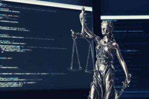 The scales of liberty with a computer running code in the background near Lawrenceburg, Kentucky (KY)