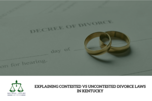 A closeup of two gold rings with a paper decree of divorce